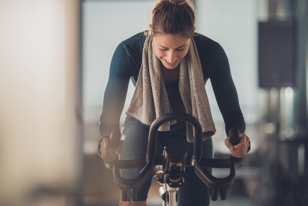 Woman is cycling in the gym