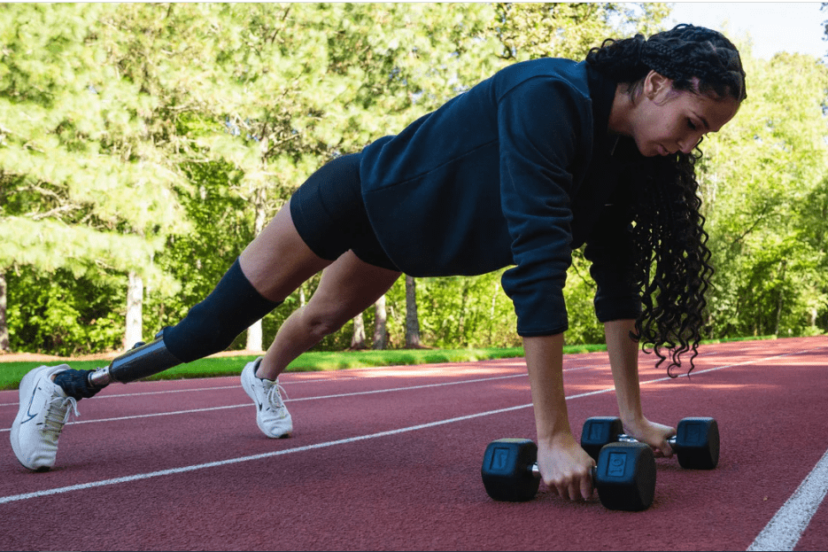 woman training with nike dumbbells