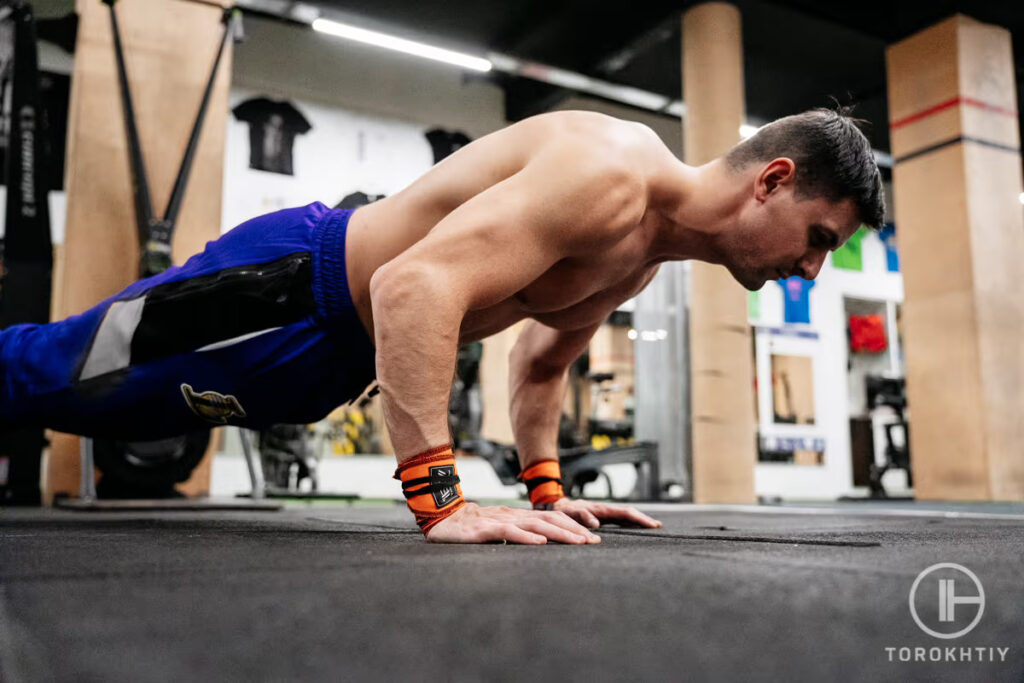 man doing push up with wrist support